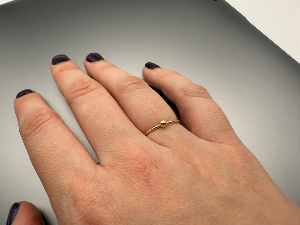 Beaded ring stacked with other rings