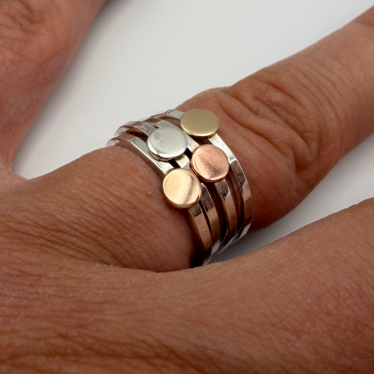 hammered sterling silver disc ring worn on hand