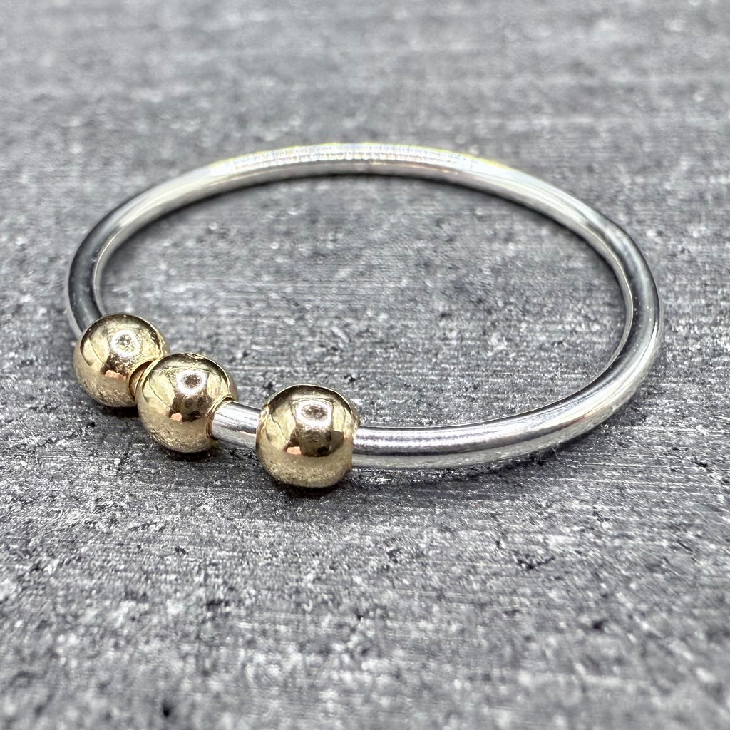9ct gold bead fidget ring worn on hand