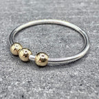 9ct gold bead fidget ring worn on hand