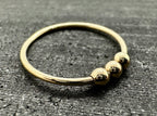 9ct gold bead fidget ring on finger