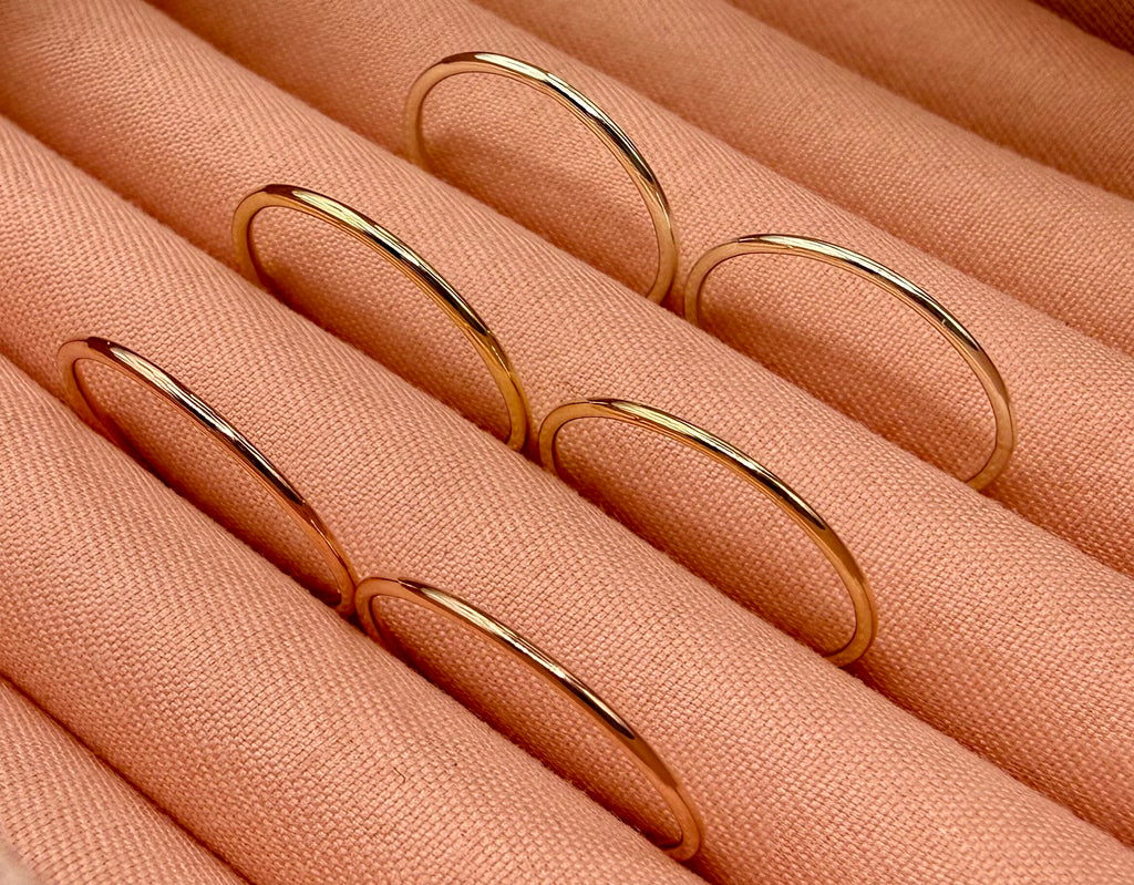 9ct gold 1.2mm stacking ring on finger