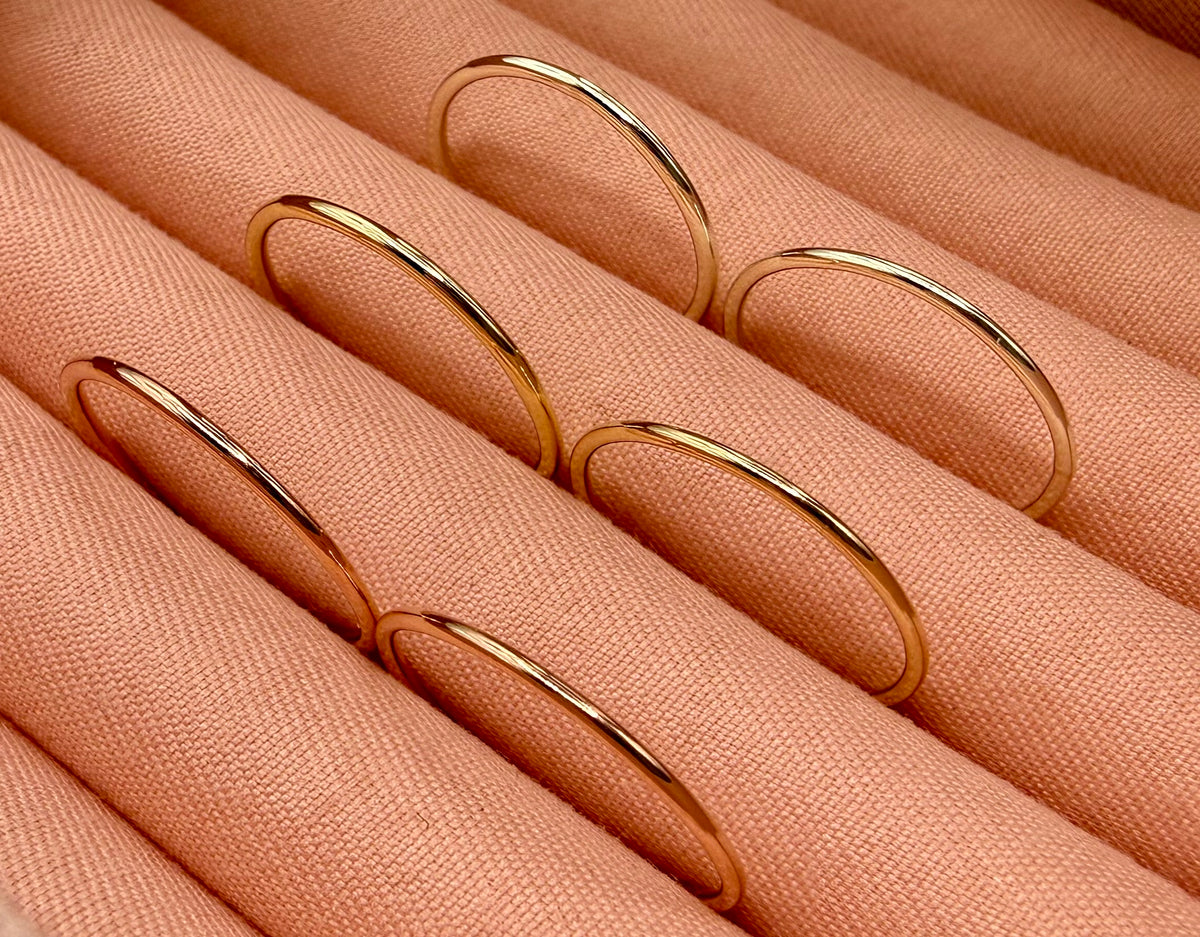 9ct gold 1.2mm stacking ring on finger