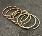 9ct gold 1mm dainty ring on finger