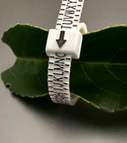 UK ring sizer being used to measure finger size