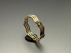 9ct gold wavy stacking ring close up angled view