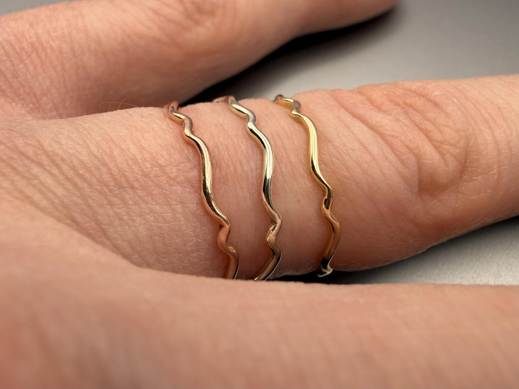 9ct gold wavy stacking ring, shown in a trio, handmade in the UK