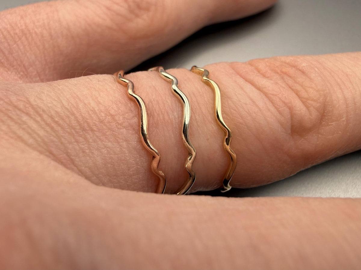 9ct gold wavy stacking ring, shown in a trio, handmade in the UK