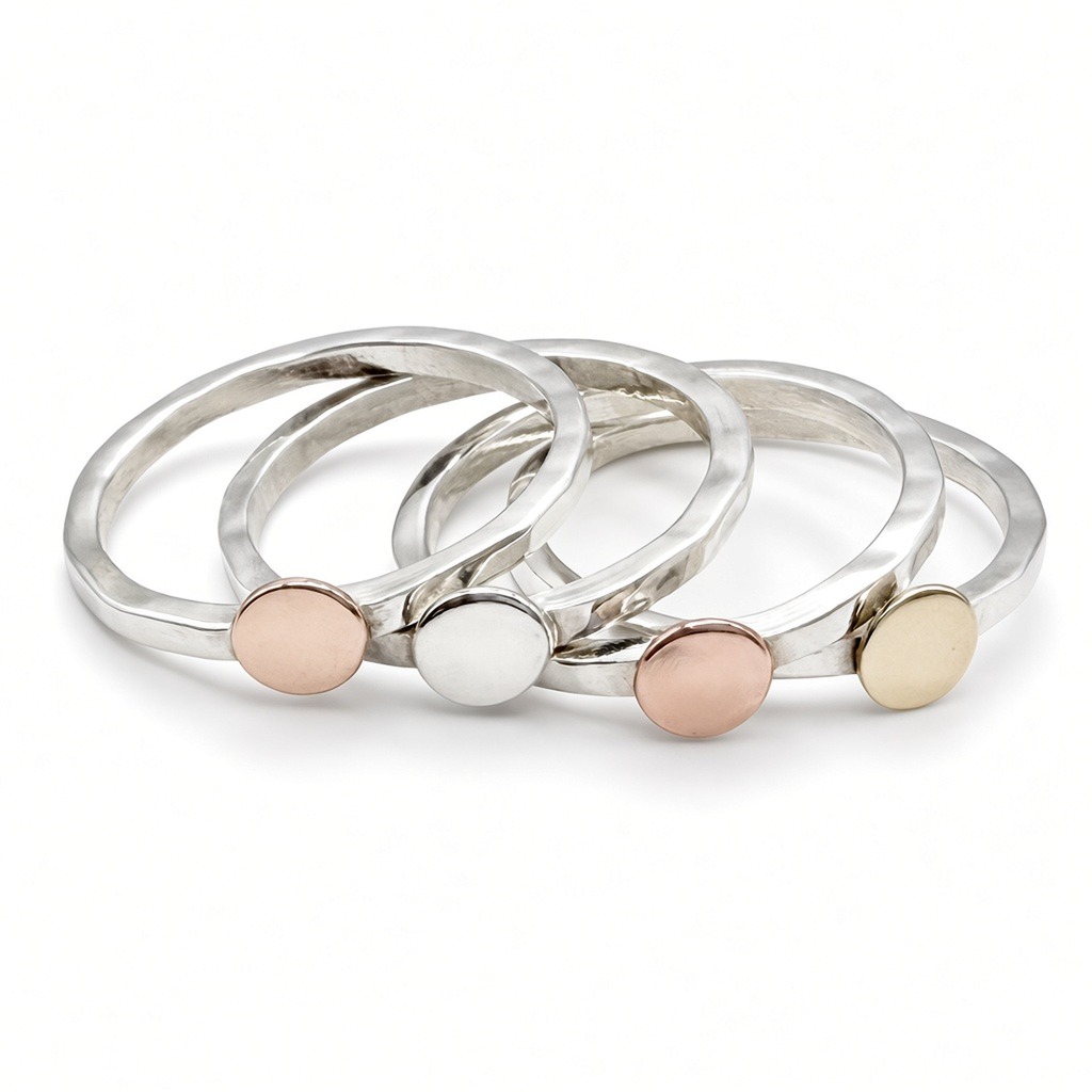 stack of four hammered sterling silver disc rings