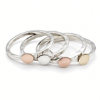 stack of four hammered sterling silver disc rings