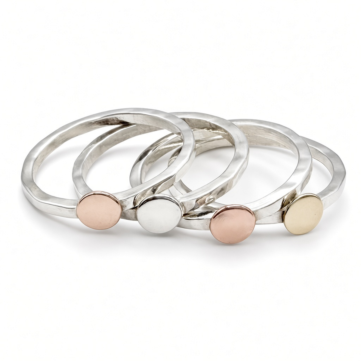 stack of four hammered sterling silver disc rings